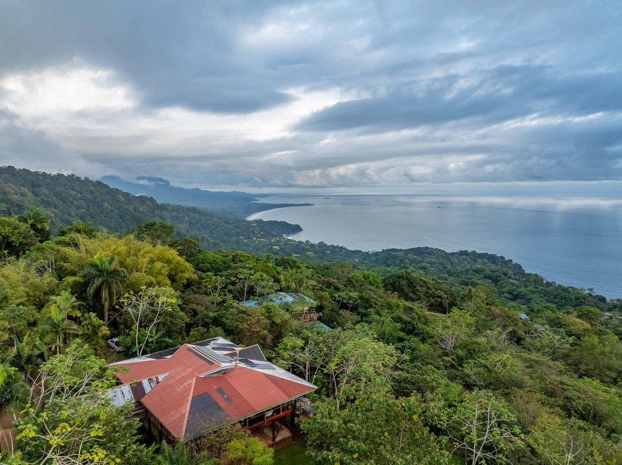 A Handcrafted Residence Immersed in Nature Above the Canopy Ocean View Architectural Home