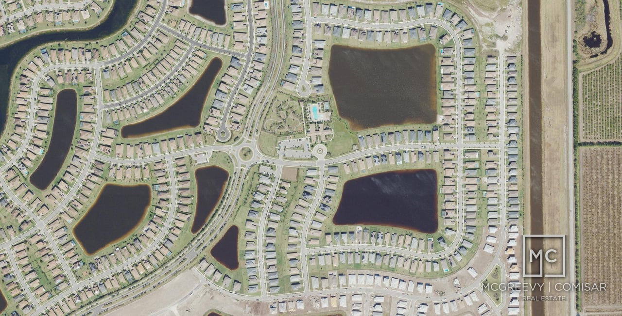 Aerial view of Maple Ridge in Ave Maria, Florida, with the Club at Maple Ridge, lakes and home streets