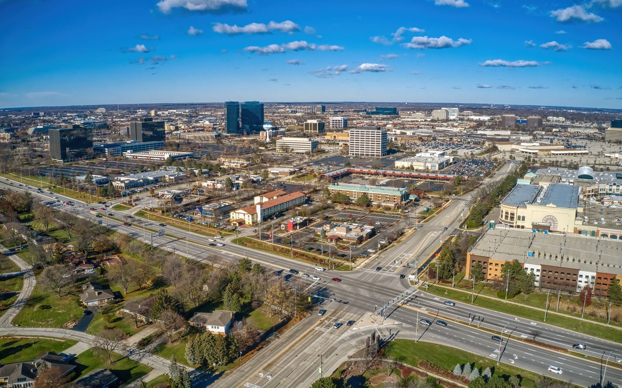 Aerial view of Schaumburg’s commercial district, with office buildings, shopping areas, and roads.