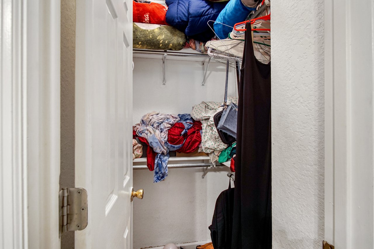 Closet at 2506 Nugget Lane in Tallahassee, Florida, with hanging rods and shelving for storage. The space provides room for clothing and linens, with both upper and lower racks for organization.