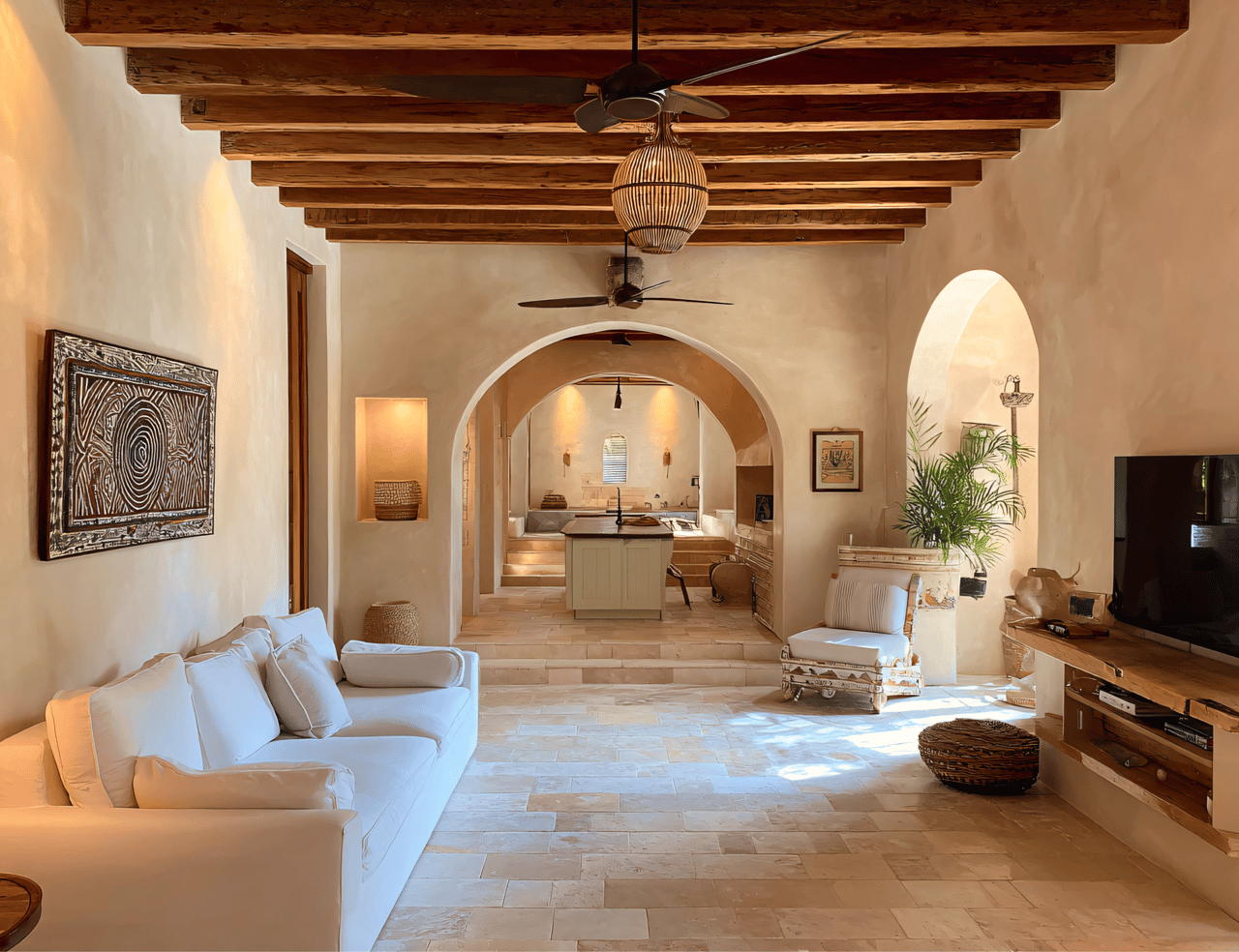 Luxury Mediterranean home interior with vaulted wood beam ceiling, stone floor, and arched doorways.