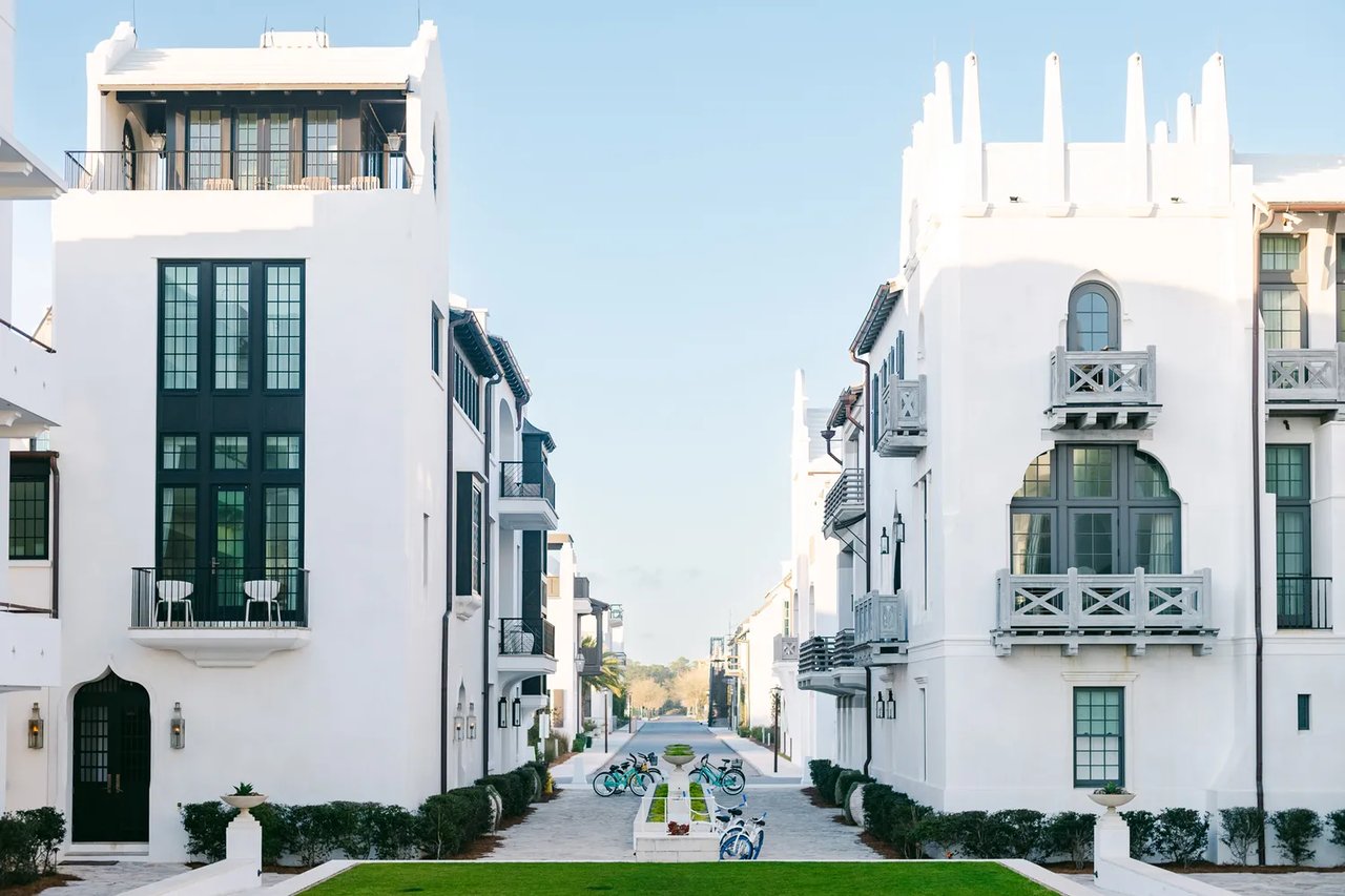 Bikes parked by white residential buildings in Alys Beach, Florida. Heather Durham/Travel + Leisure