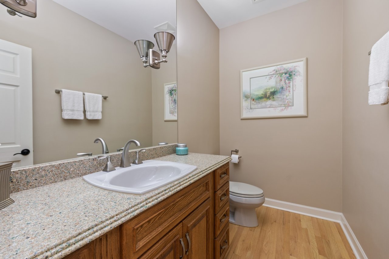 Beautifully Appointed Home in a Gated Community on Over an Acre of Professionally Landscaped Grounds with Pond Views
