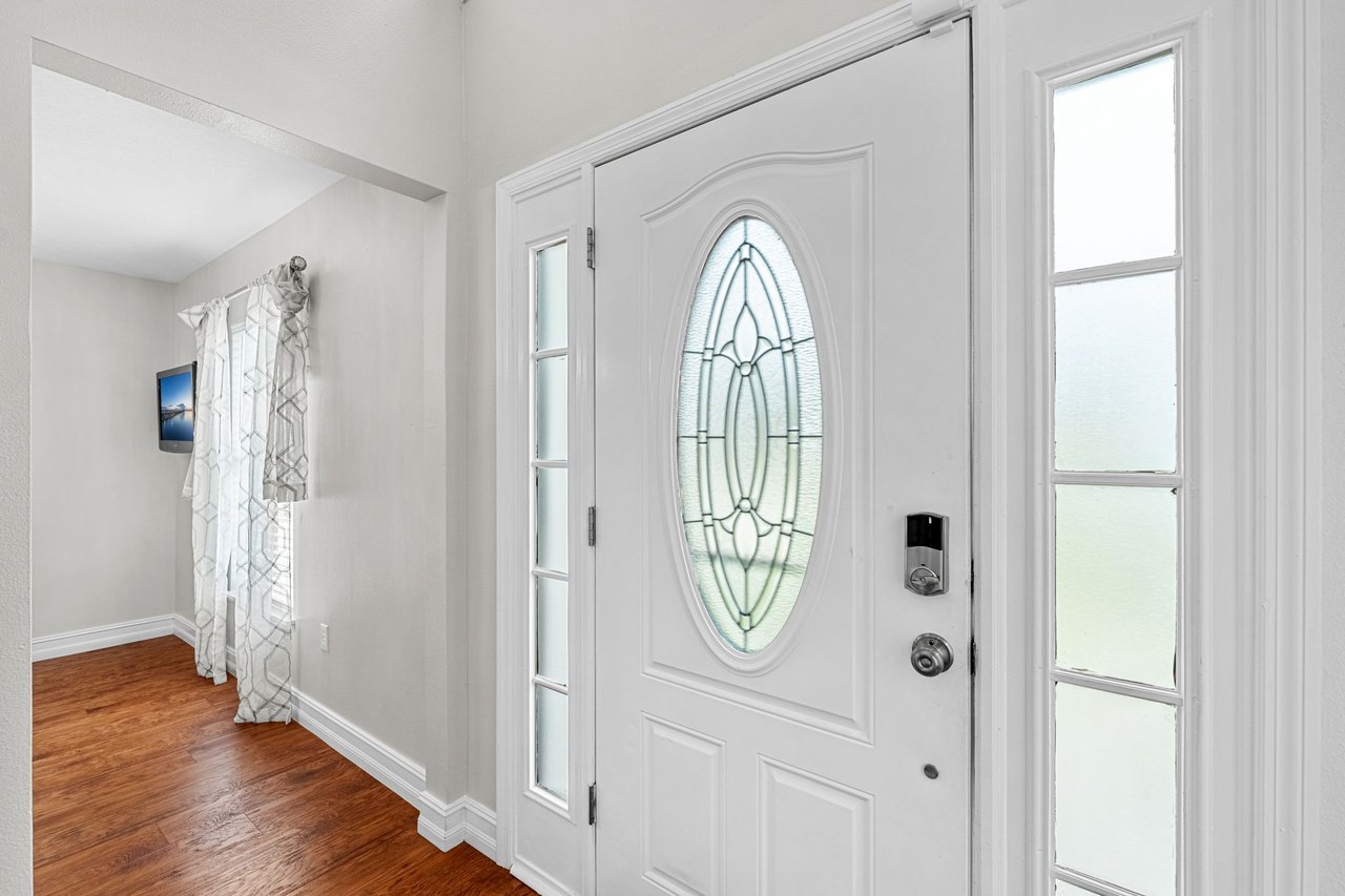 Front entry with arched window detailing