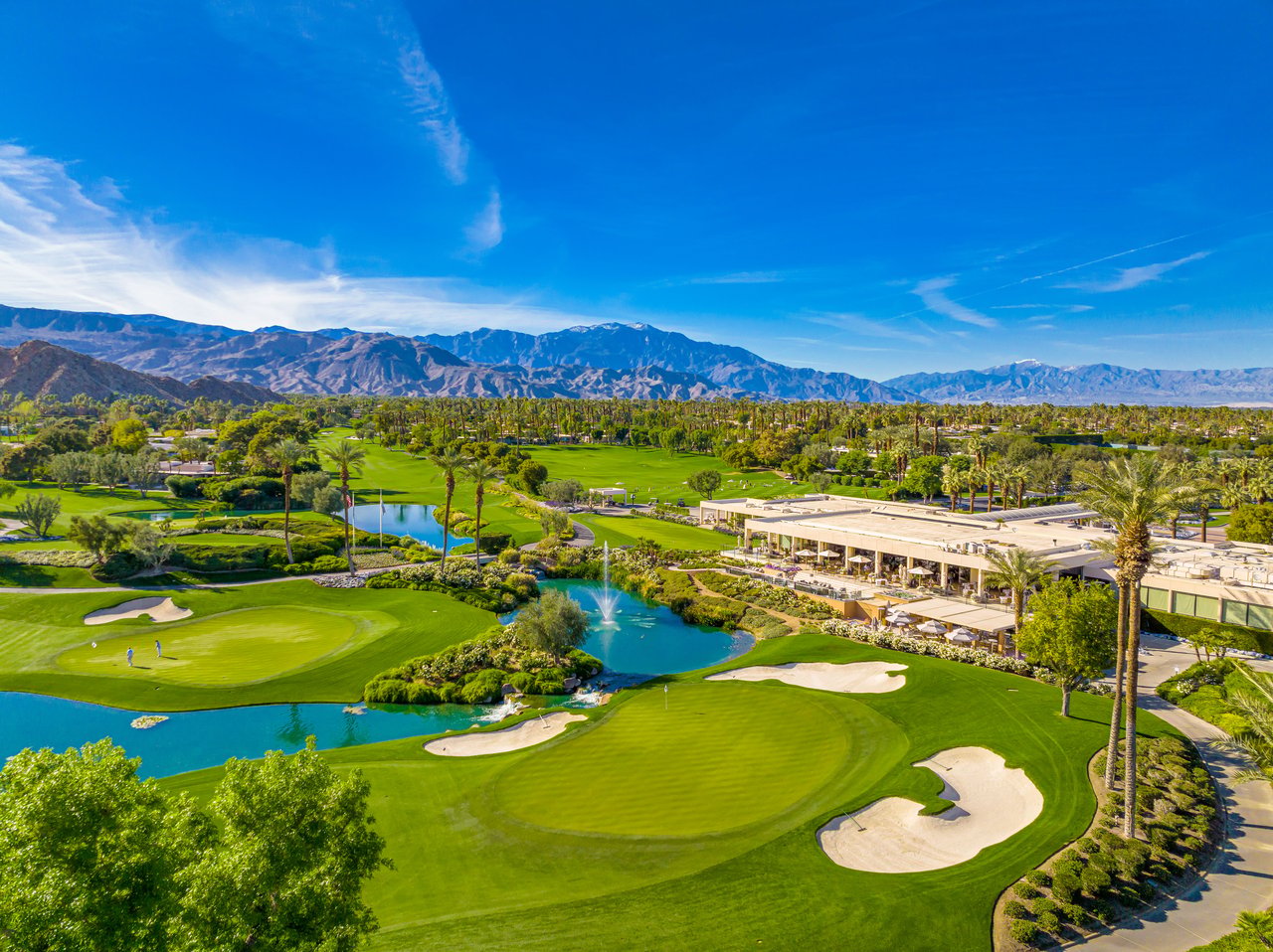 Eldorado Country Club golf green, water hazard, and Santa Rosa Mountains backdrop in Indian Wells