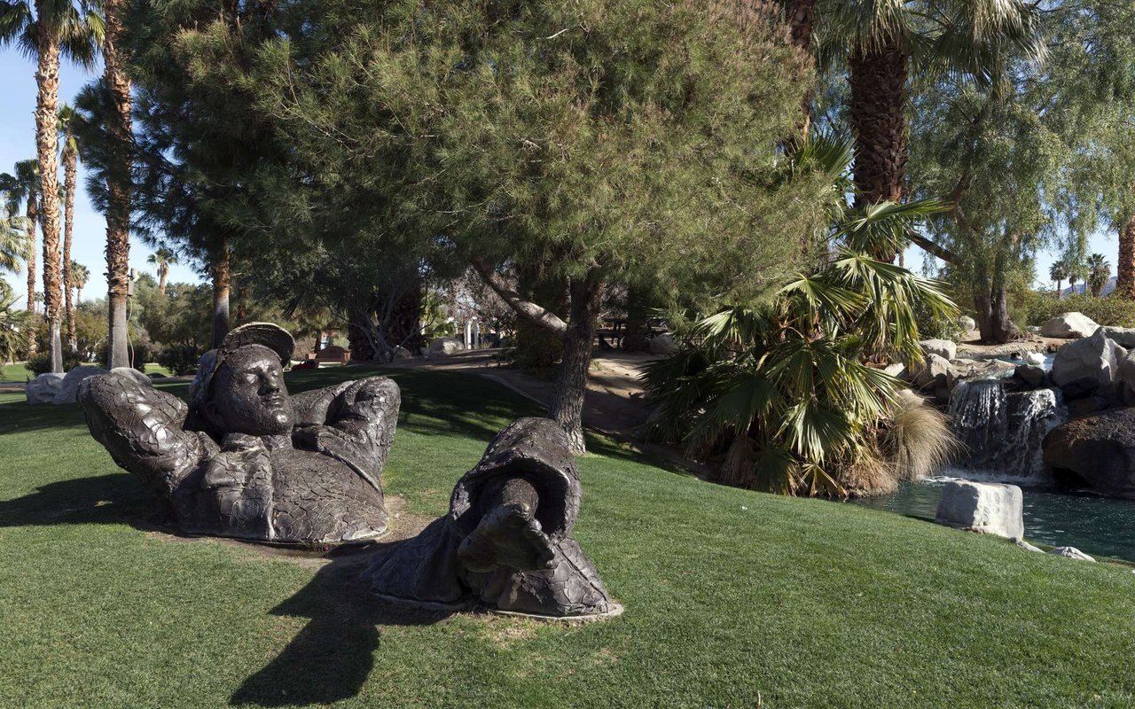 The Dreamer sculpture and palms at Palm Desert Civic Center Park in 2013