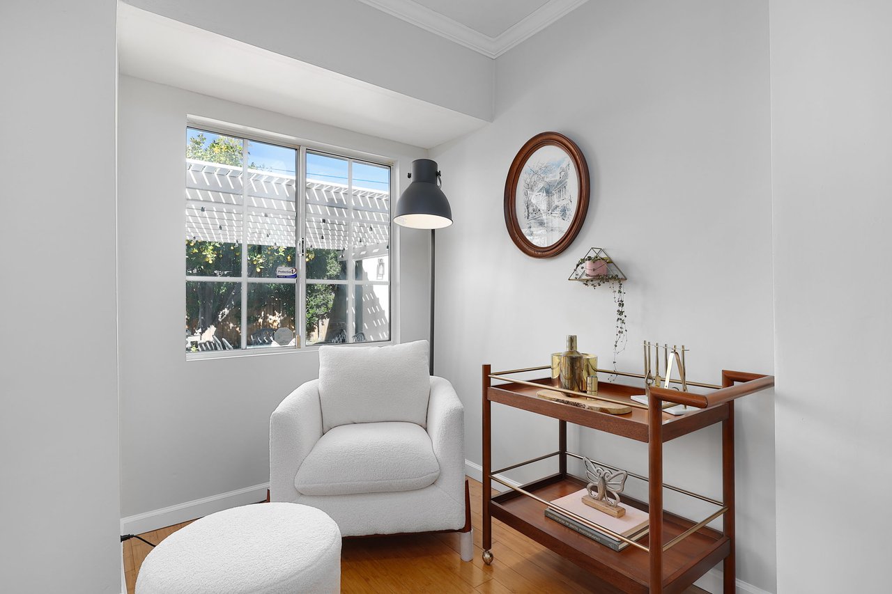 Bright dining area with backyard views, pendant lighting, and warm wood finishes inside Lake Balboa home