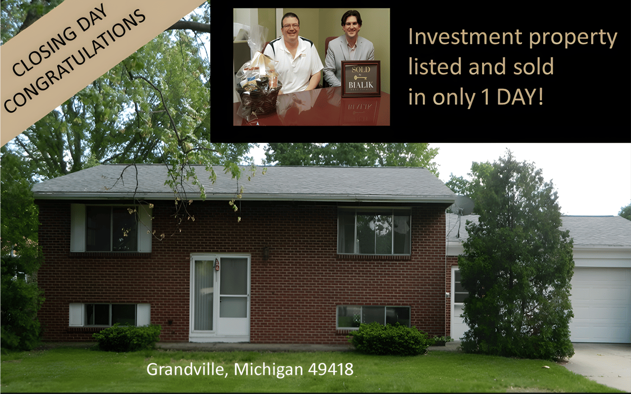 Grandville brick home in a closing congratulations graphic, with an inset photo of two men and a sold sign.