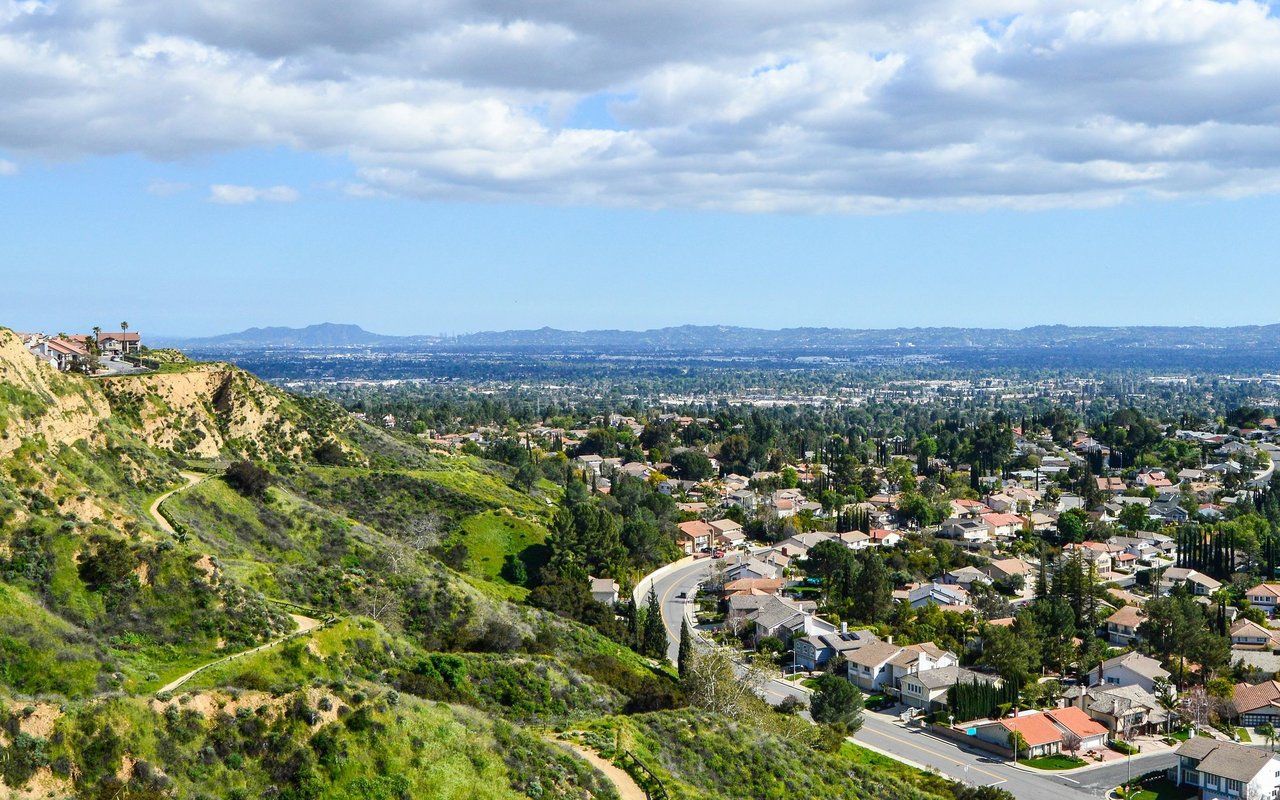 Porter Ranch hillside homes and trails overlook a broad residential valley.