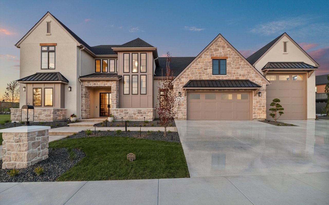 Front exterior of the home showing the garages