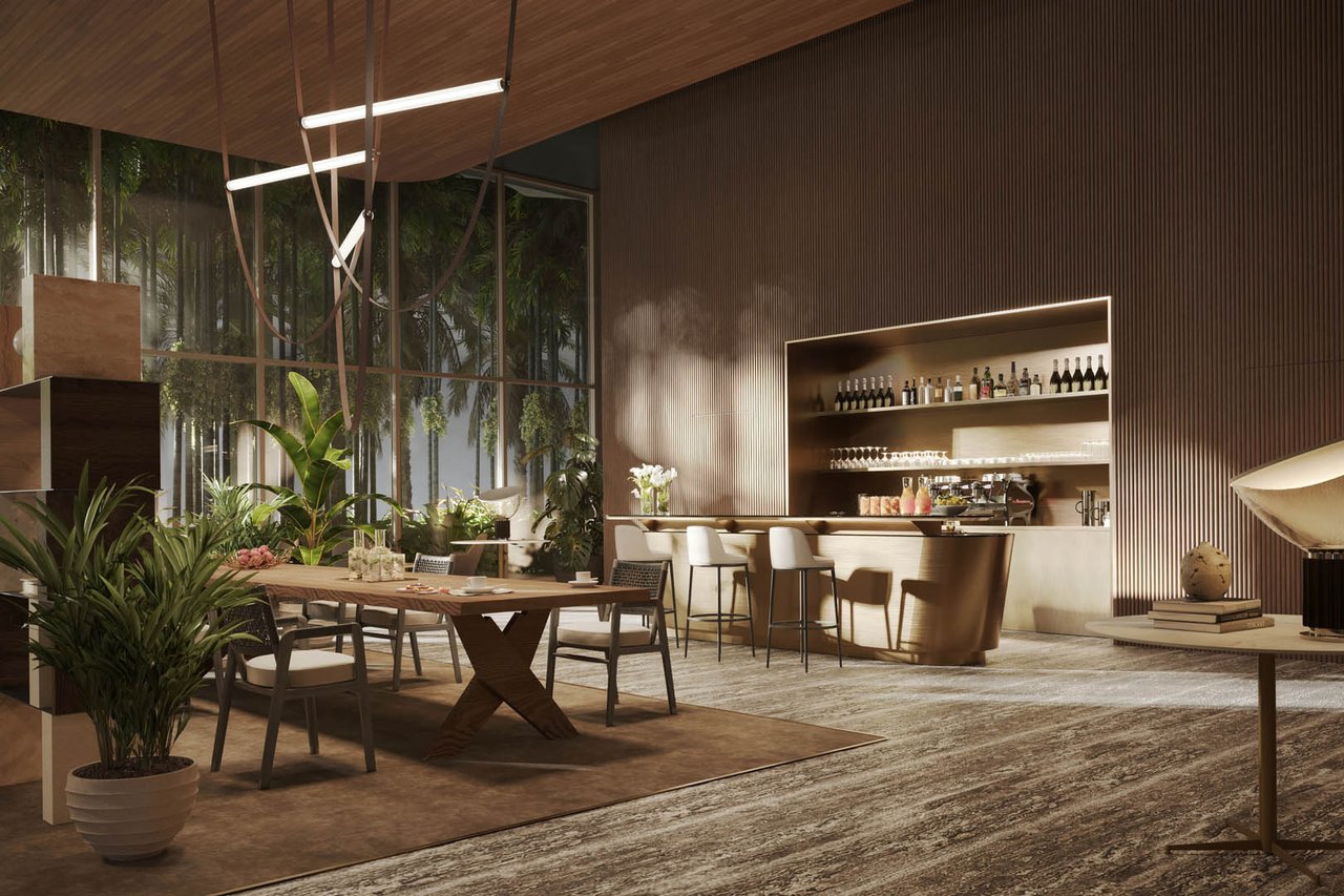 Amenity lounge with a dining table, bar counter, and floor-to-ceiling windows overlooking greenery.
