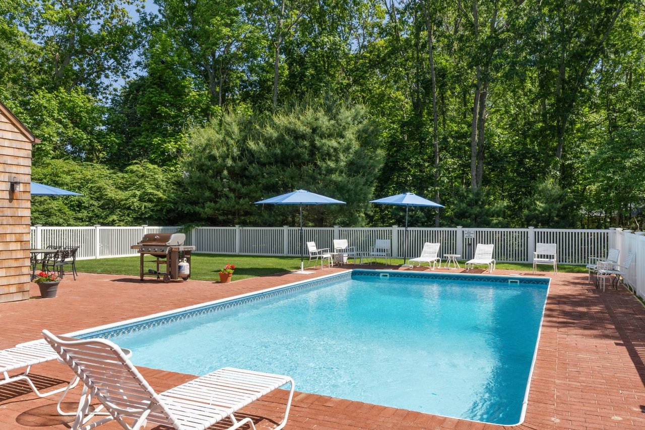 INVITING YEAR-ROUND OR SEASONAL RETREAT WITH HEATED POOL