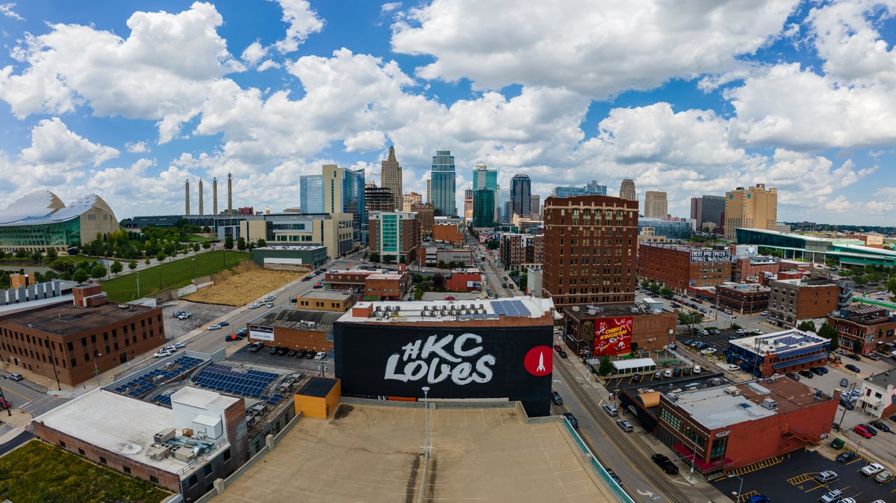 Aerial view of downtown Kansas City with the “#KC Loves” mural in the foreground.