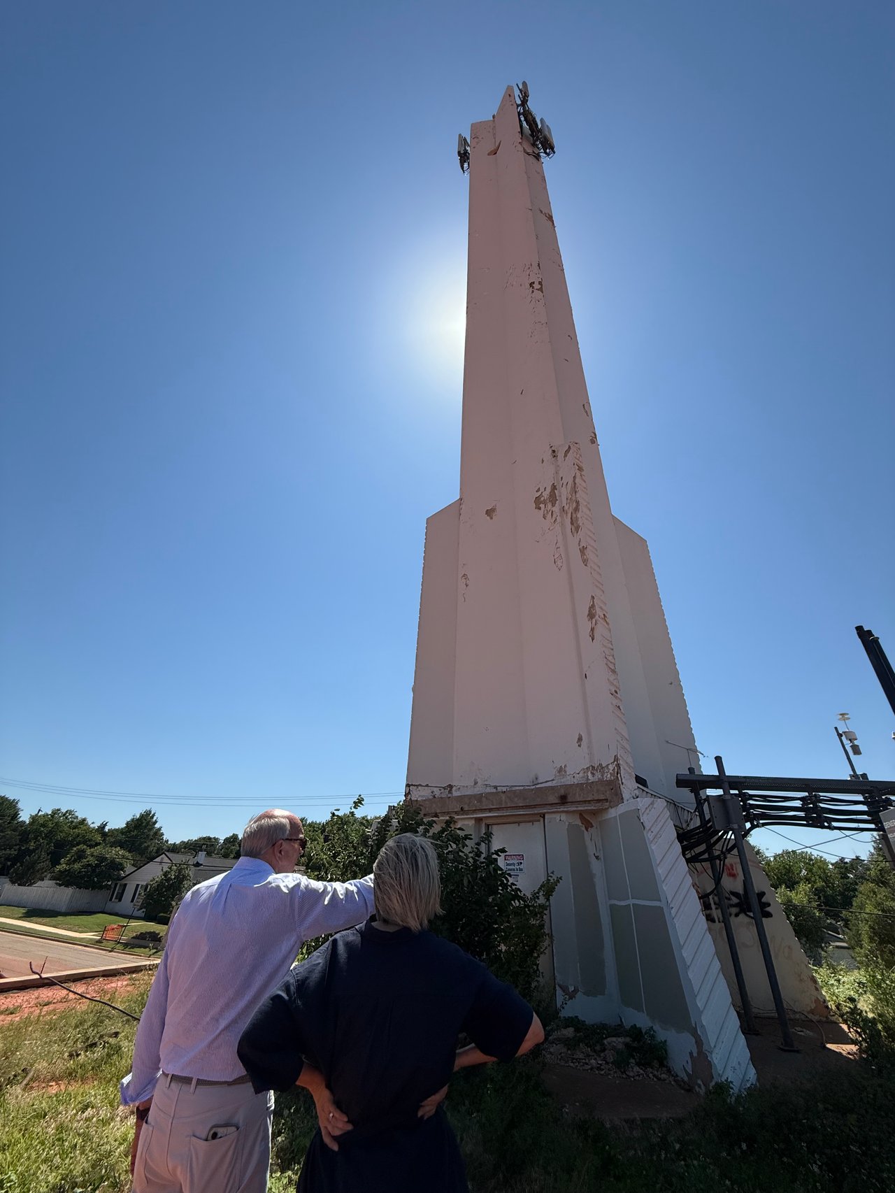 Ron Bradshaw and Jennifer Kragh debating possible paint swatches for Lexford Park's historic bell tower