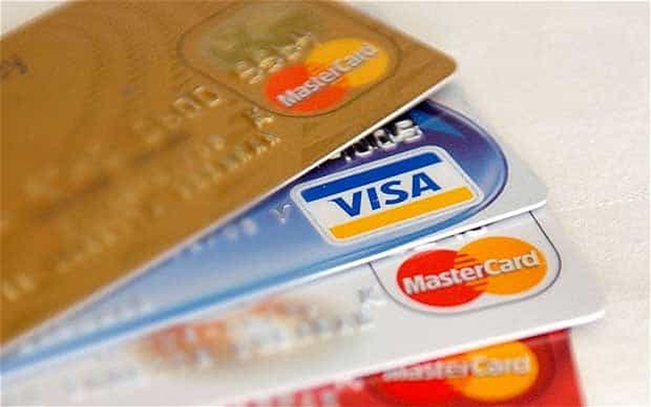 Overlapping credit cards with visible Visa and Mastercard logos.