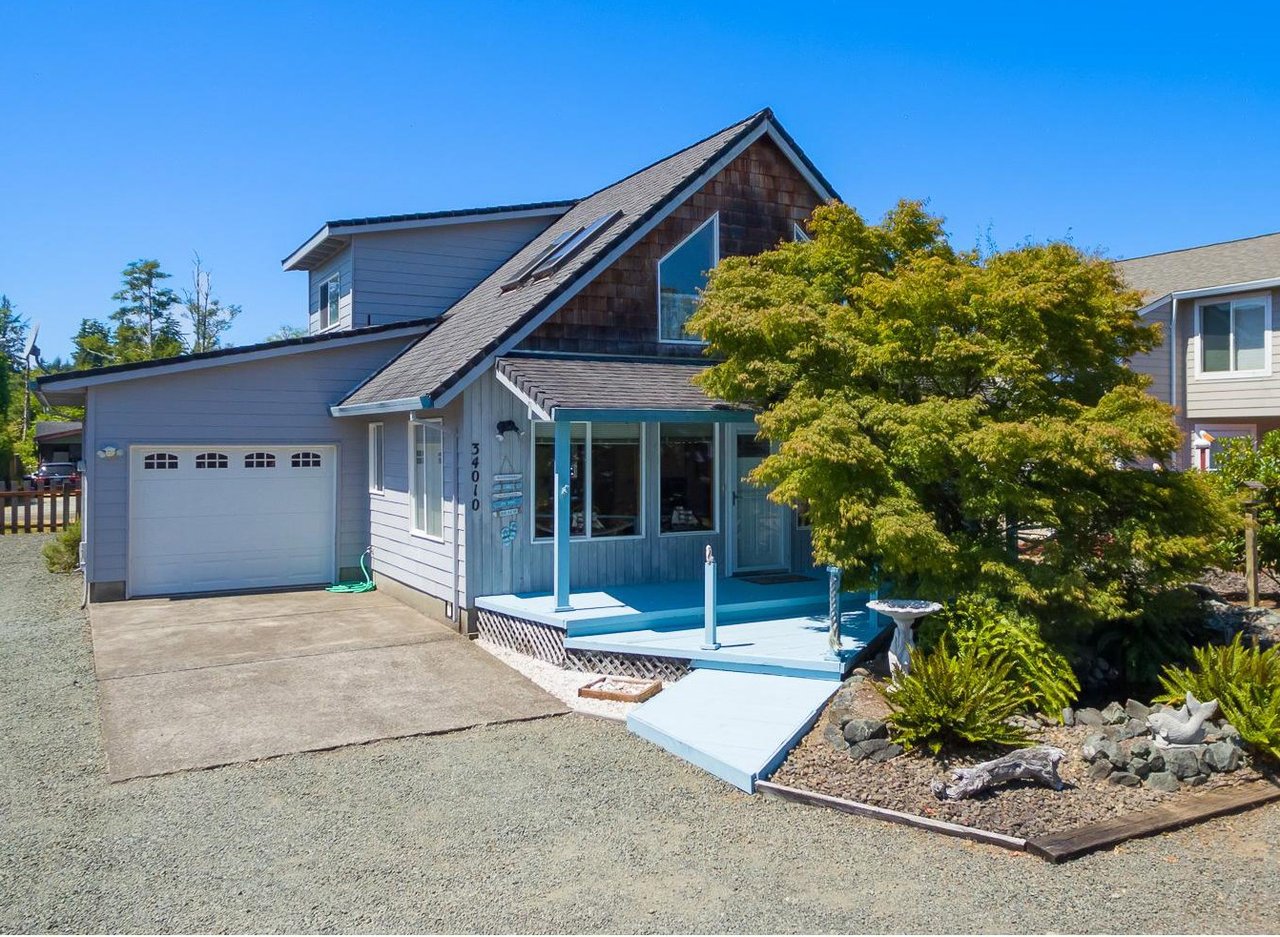 Sold Nehalem home at 34010 Mallard Ave represented by Meadow Davis of Home + Sea Realty with vaulted ceilings, garage, and RV parking