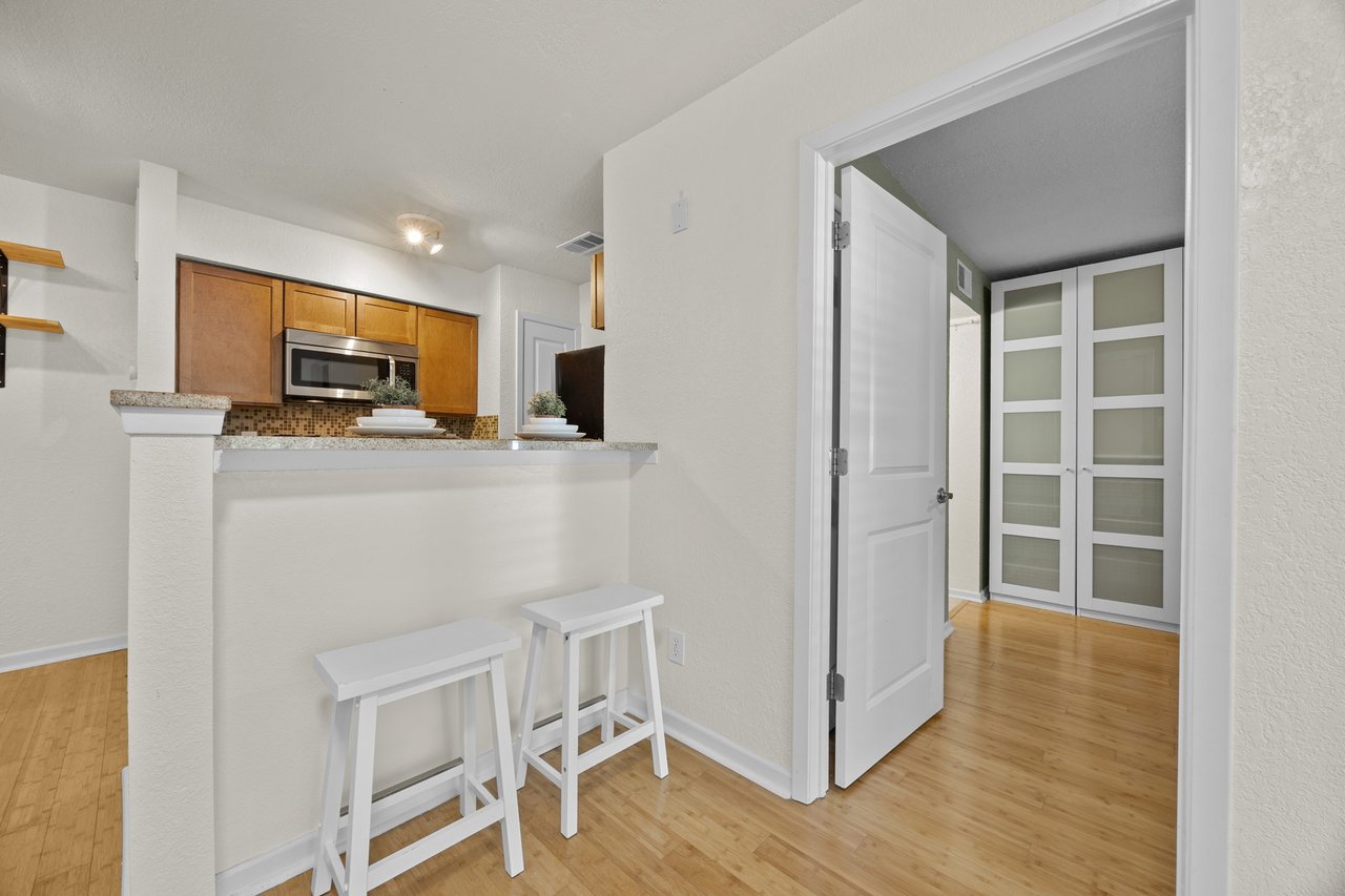 Top-Floor Condo Retreat in Gated Ivy Condos | Private Balcony + Tree-Filled Views