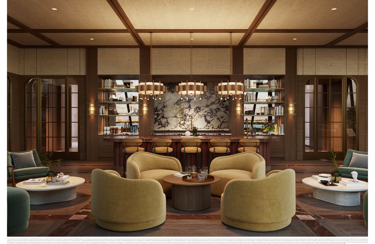 Lounge and bar with a marble backsplash, built-in bookshelves, and curved seating.
