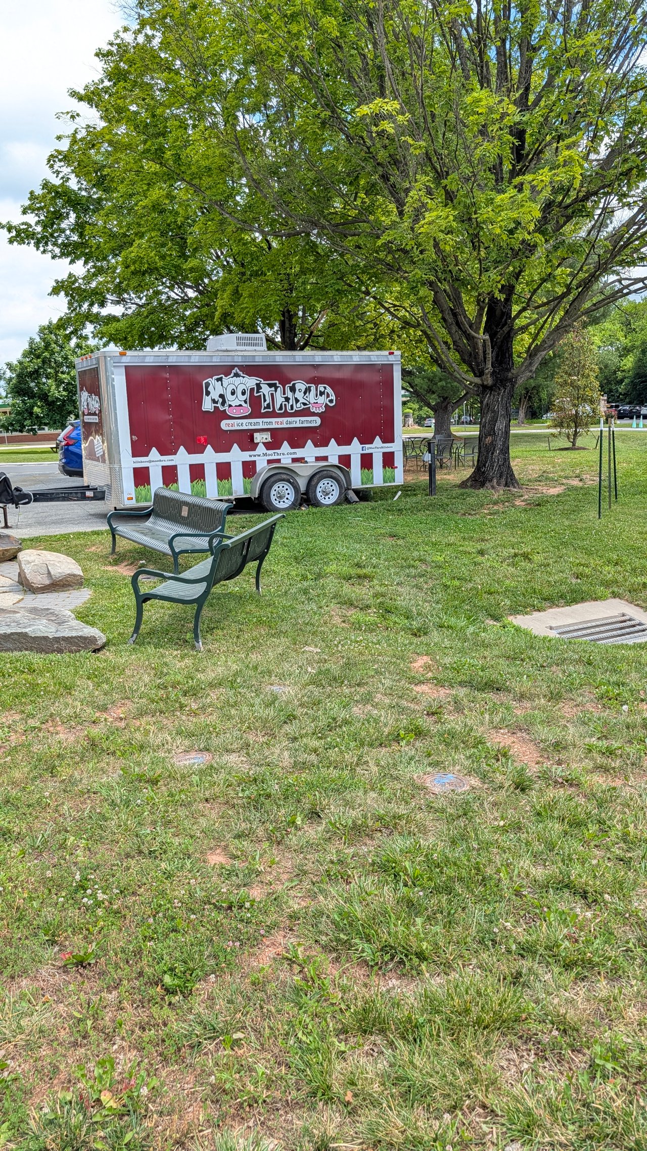 The bright Moo Thru ice cream trailer and outdoor seating area located at the Old Stone School grounds in Hillsboro, VA, documented by local real estate expert Diane Geremia.