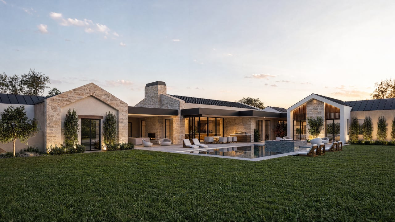 Modern stone-and-stucco home with a rectangular pool, outdoor seating, and a broad lawn.