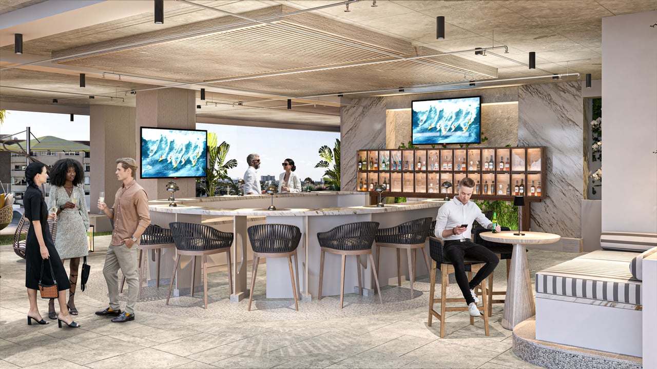 Residential lounge and bar with a marble counter, bar stools, and illuminated bottle display.