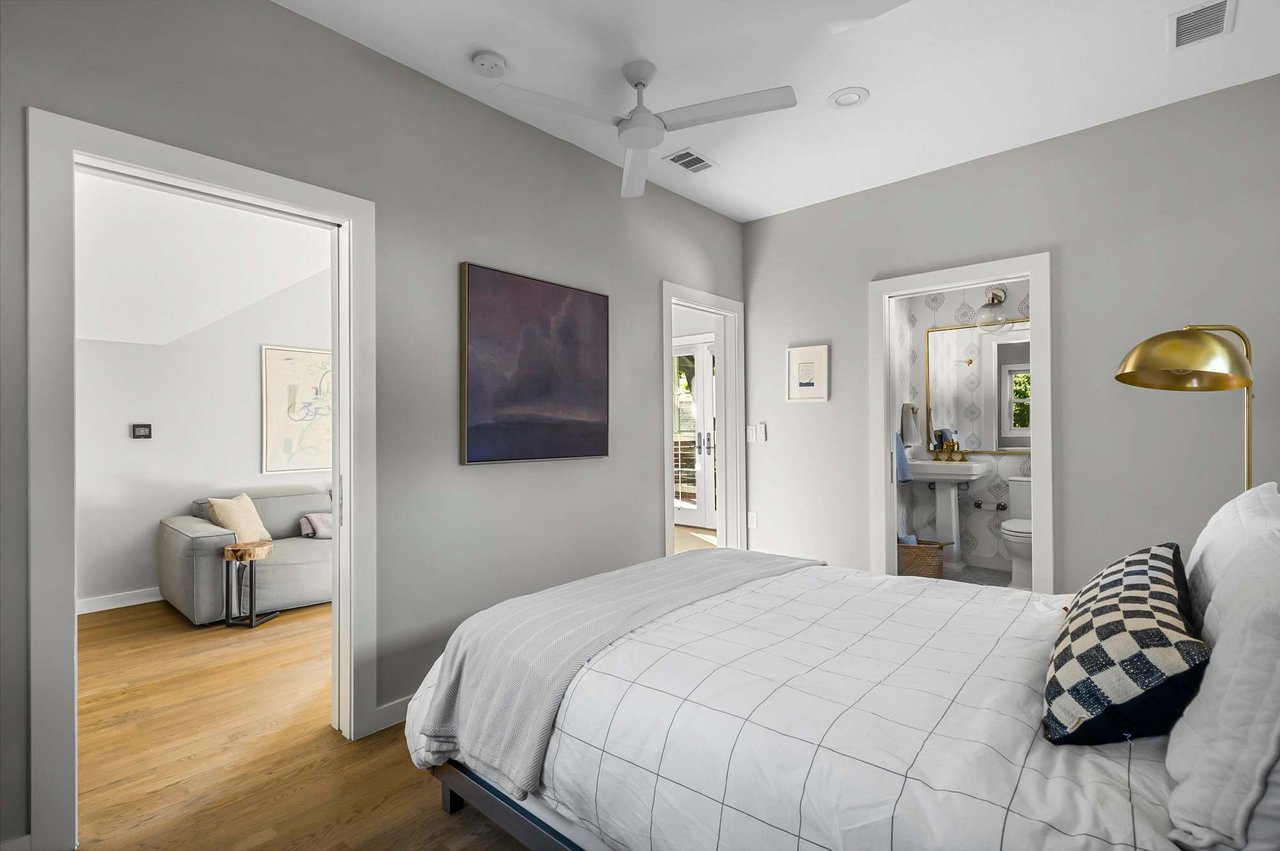 Bedroom with ensuite bath at 1500 Northwood Rd, Pemberton Heights, Austin.