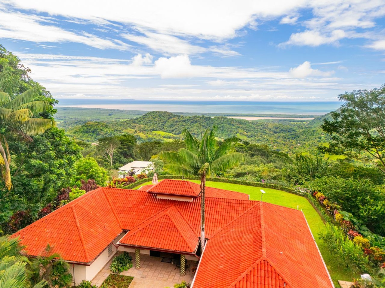 Ocean, jungle & mountain views on a meticulously landscaped 3-home family compound