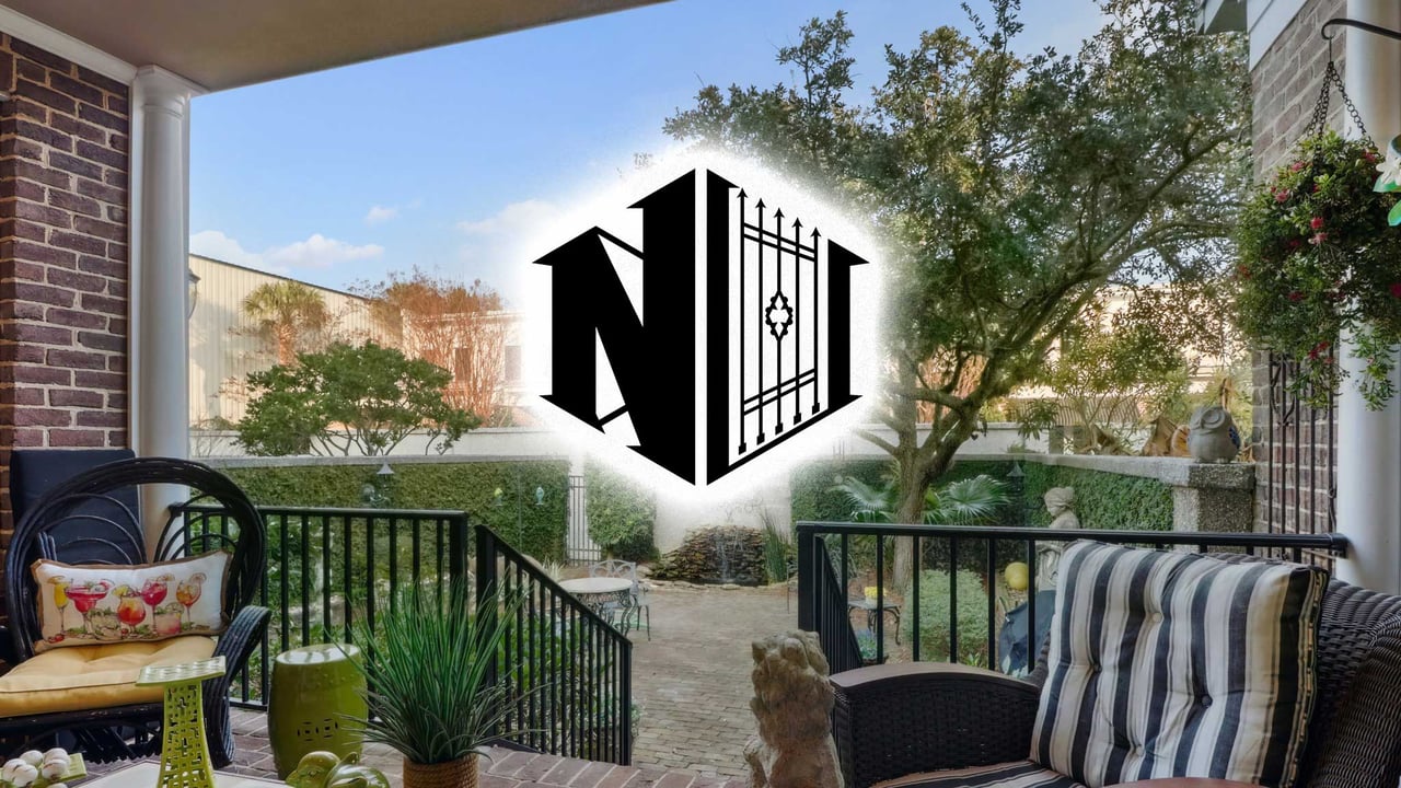 Private walled courtyard with Koi pond and Live Oak at 44 Chaucer Street in Turners Cove, Savannah, GA – Featured by Nelsen Real Estate for the 2026 market update.