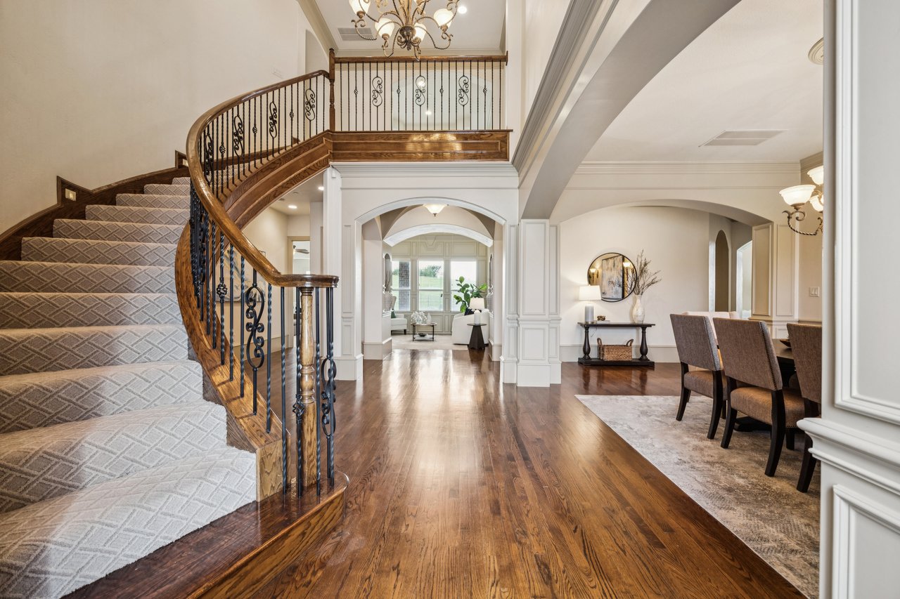 two story entry with curved staircase