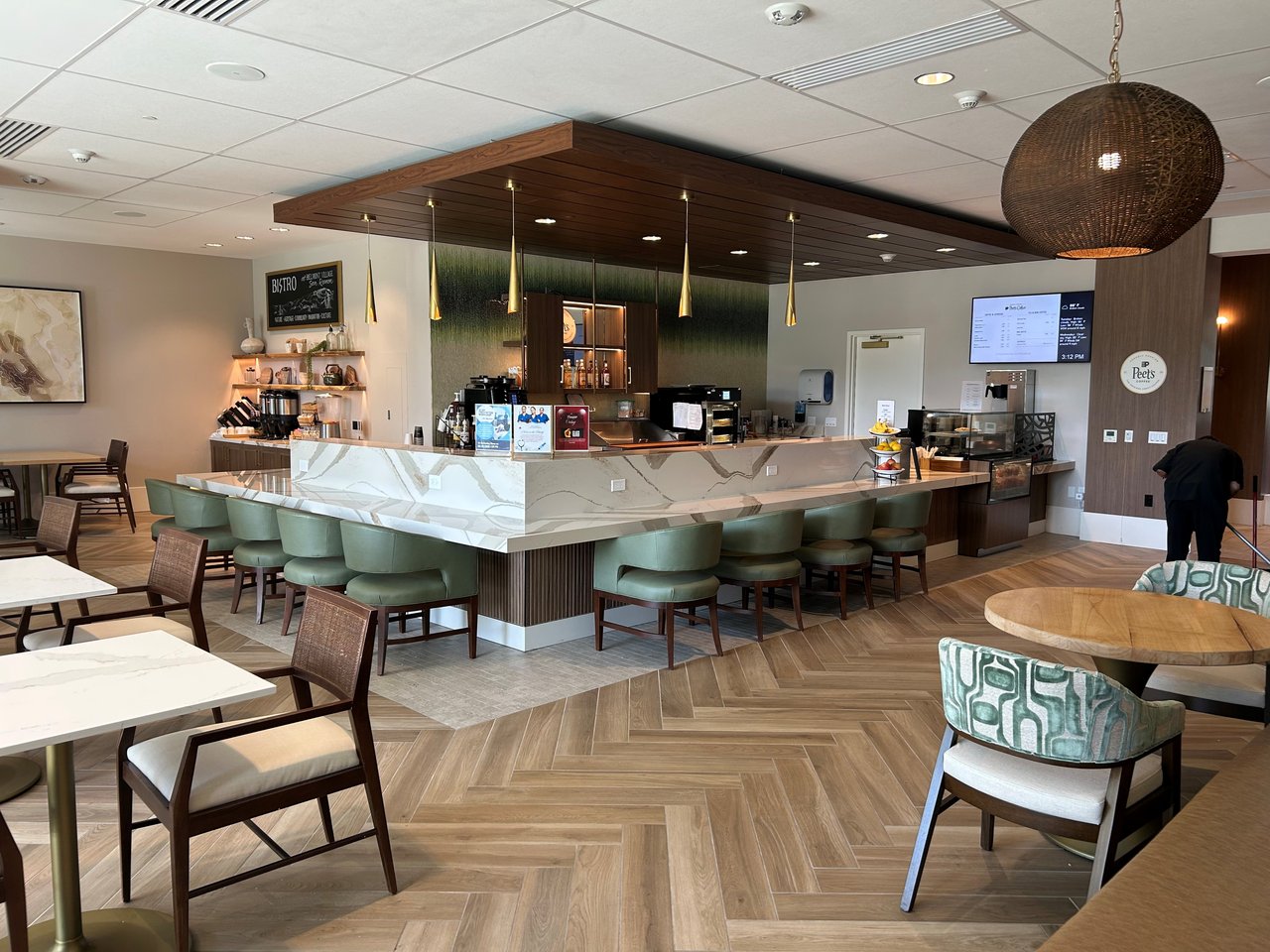 "Casual bistro and coffee bar seating area at Belmont Village San Ramon"