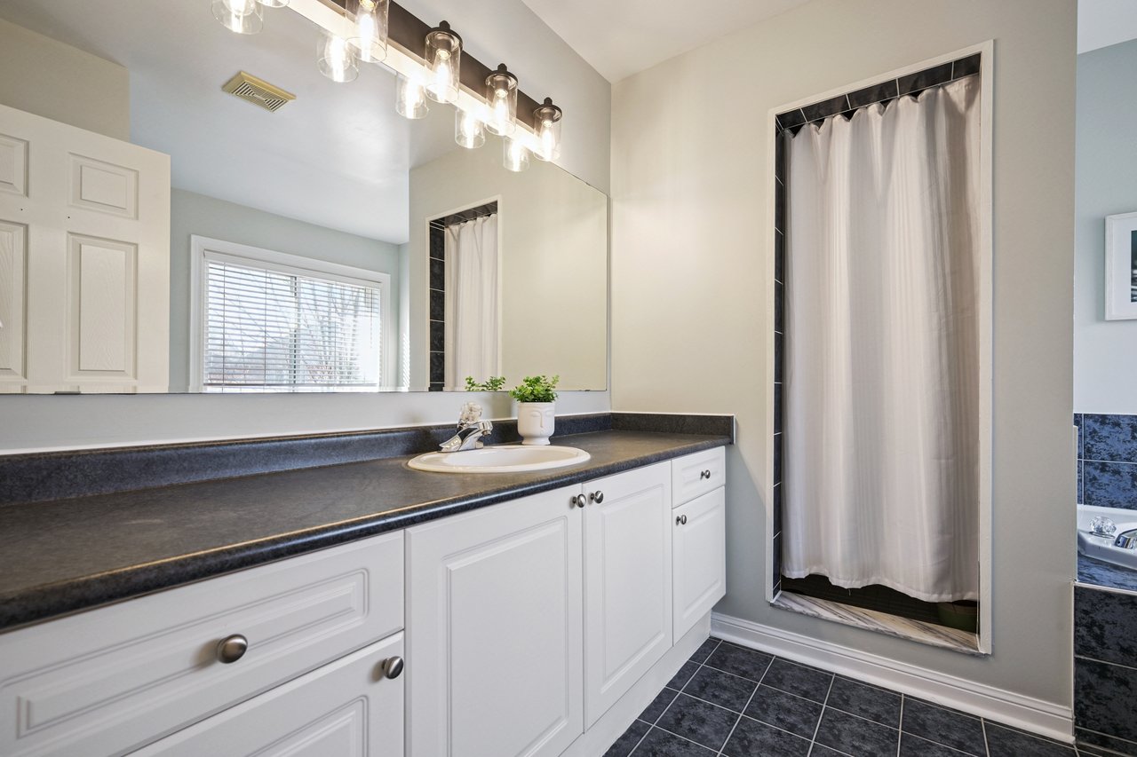 Sun-Filled Sophistication on a Rare Pie-Shaped Lot in West Oak Trails