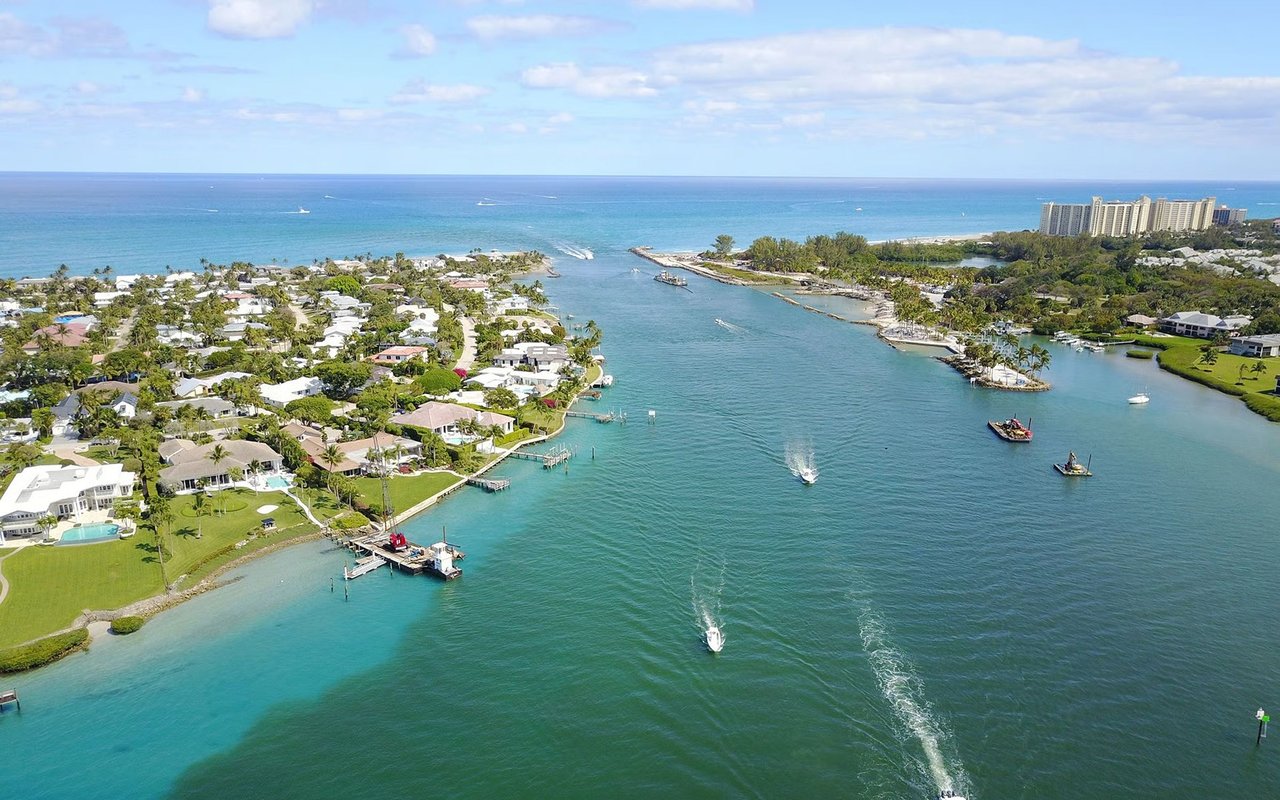 Jupiter Inlet Colony waterfront homes and docks along the inlet to the Atlantic Ocean.