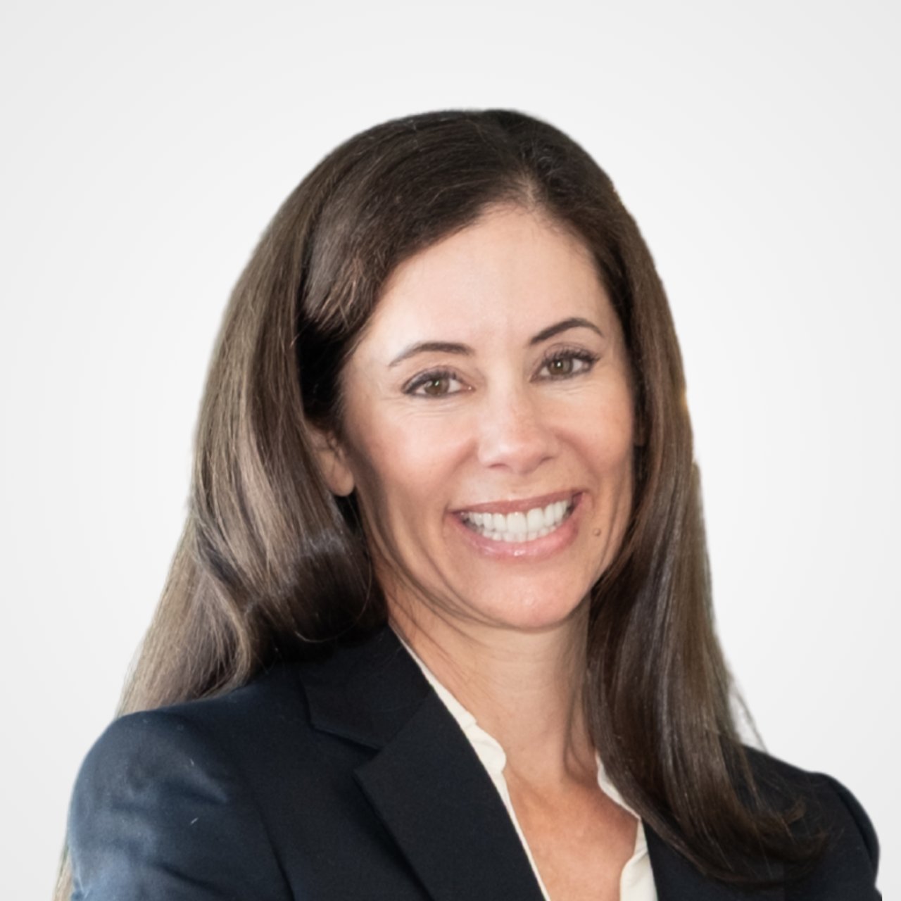 Gina Piper smiling in a dark blazer and white blouse.