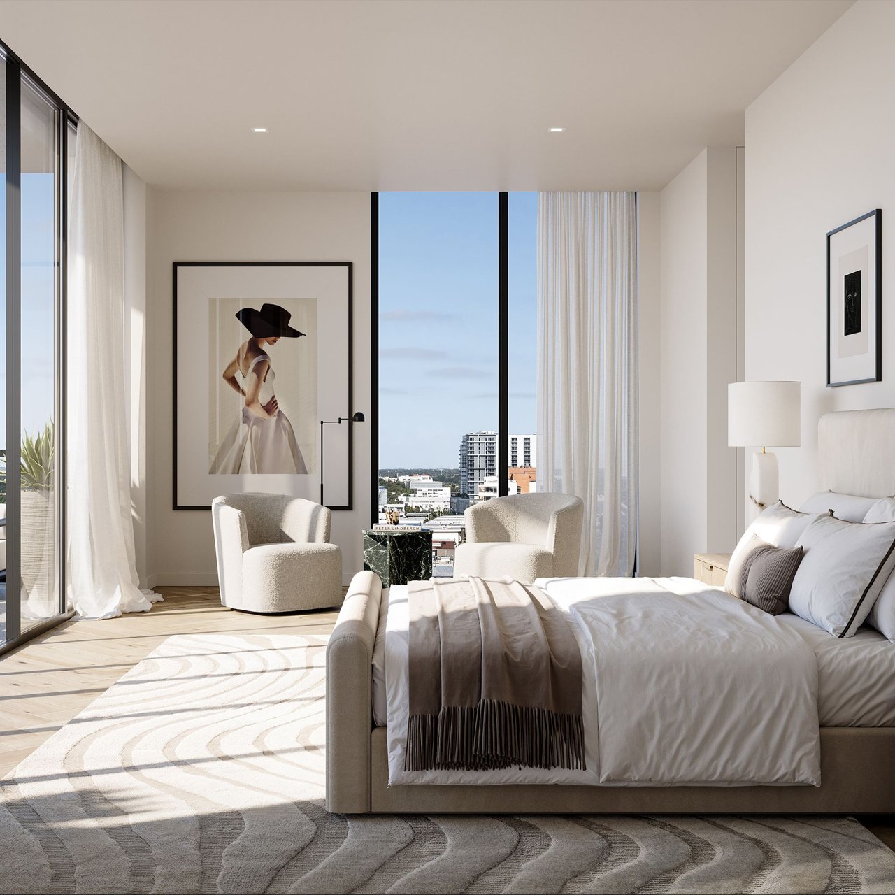 Staged modern bedroom with floor-to-ceiling windows, city views, and framed fashion artwork.