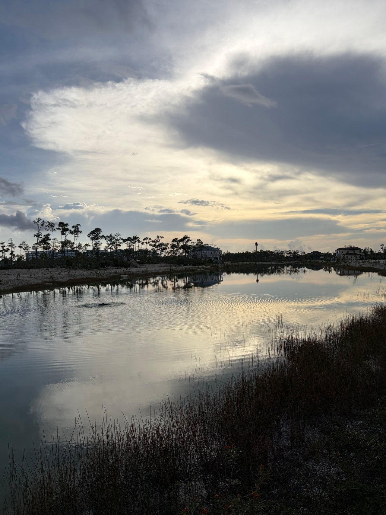 Sunset over a living lake at Windsor Lakes, Nassau, part of the community's eco-friendly drainage system