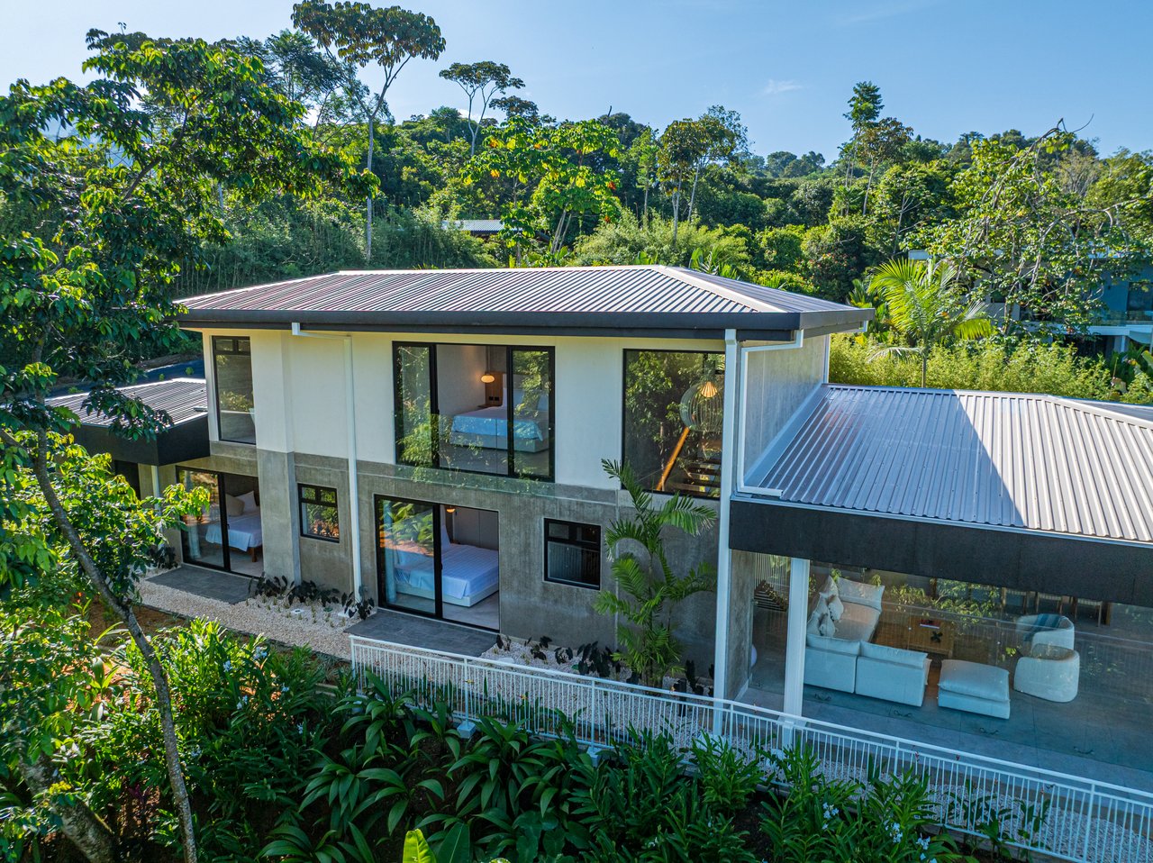 New contemporary tropical villa boasts with a movie theater and views of the iconic whale’s tail