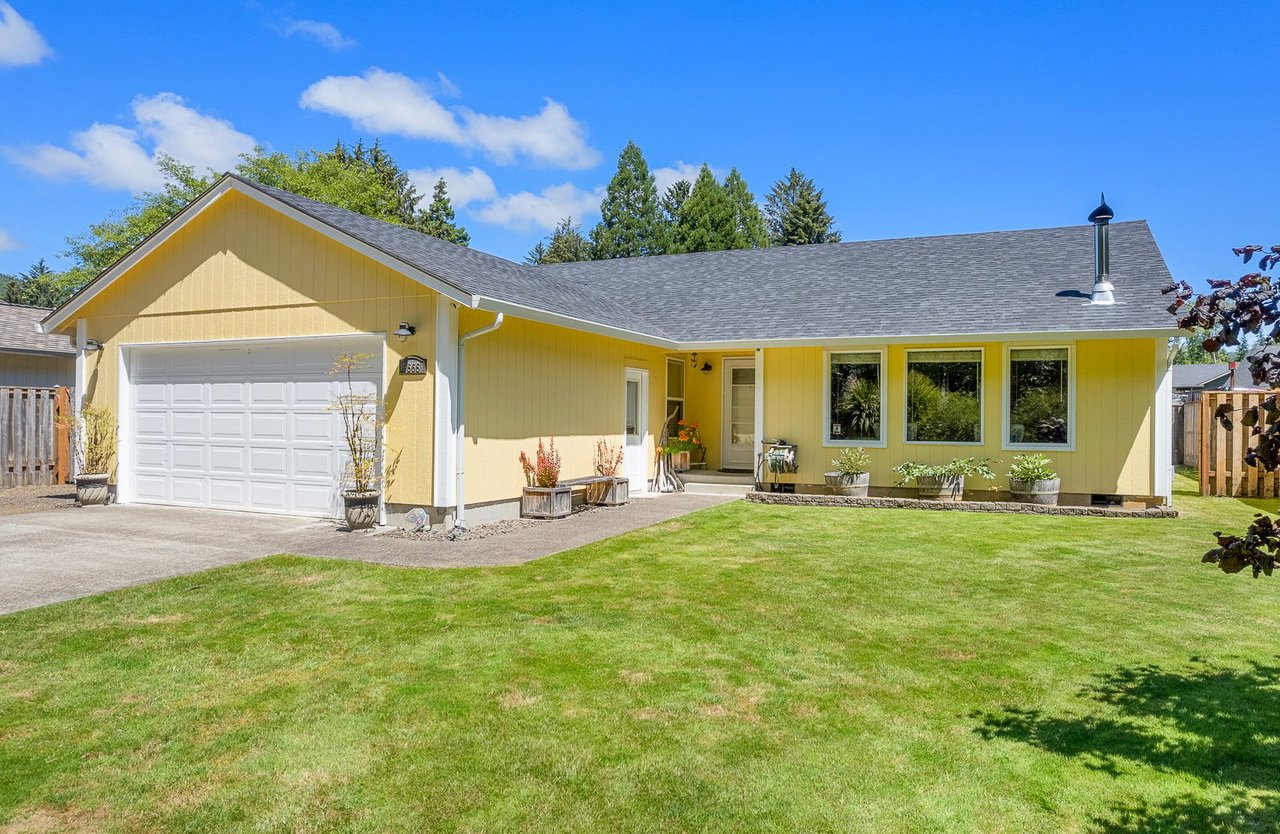 Sold single-level home at 9555 9th St in Bay City, Oregon, represented by Leisha Mizee-Riggert of Home + Sea Realty, with a fenced yard and remodeled kitchen.