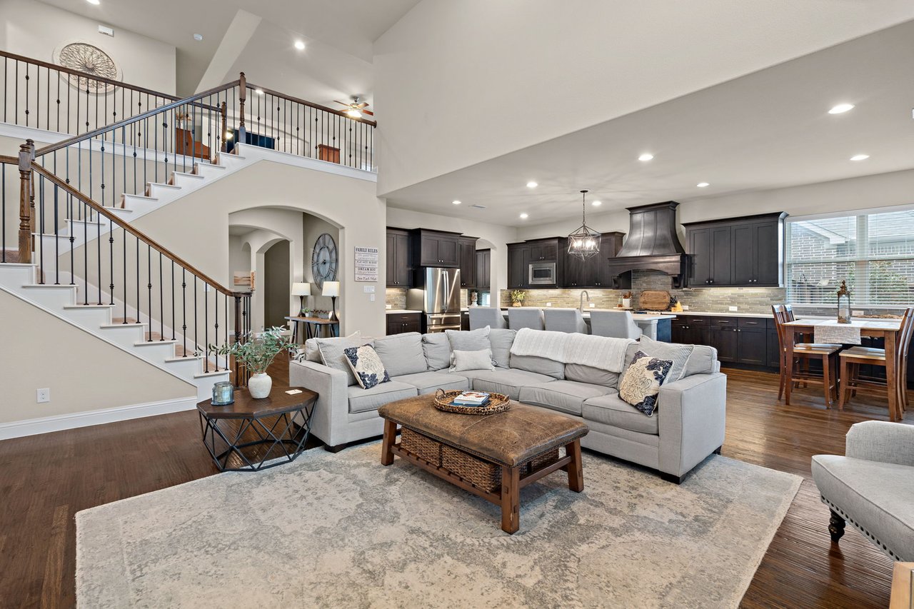 Modern open-concept living room and kitchen showcasing features that add value to a home