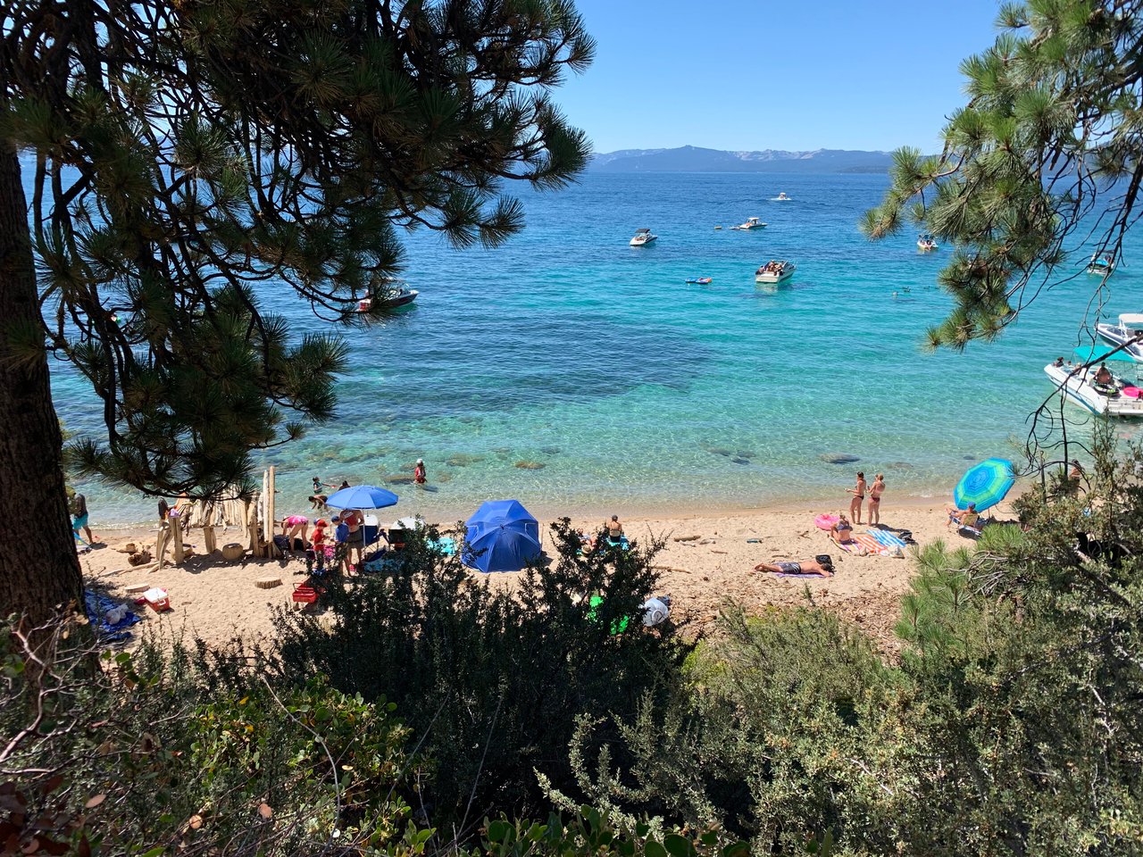 Incline Village residents enjoying summertime amenities like private beaches and golf under the sun