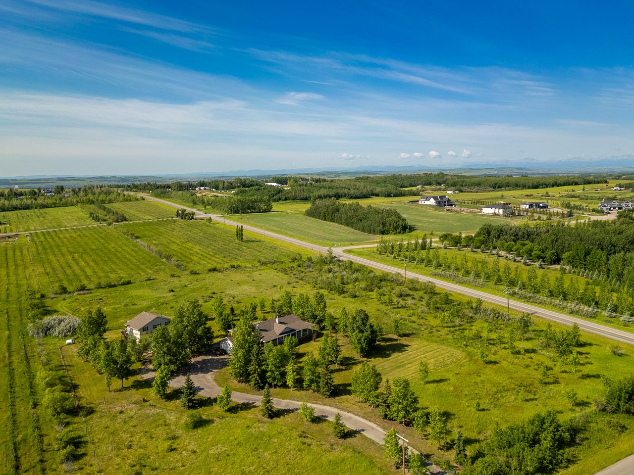 Peace, Profit & Possibility: 6 Acres with a Legal Suite Minutes from Okotoks