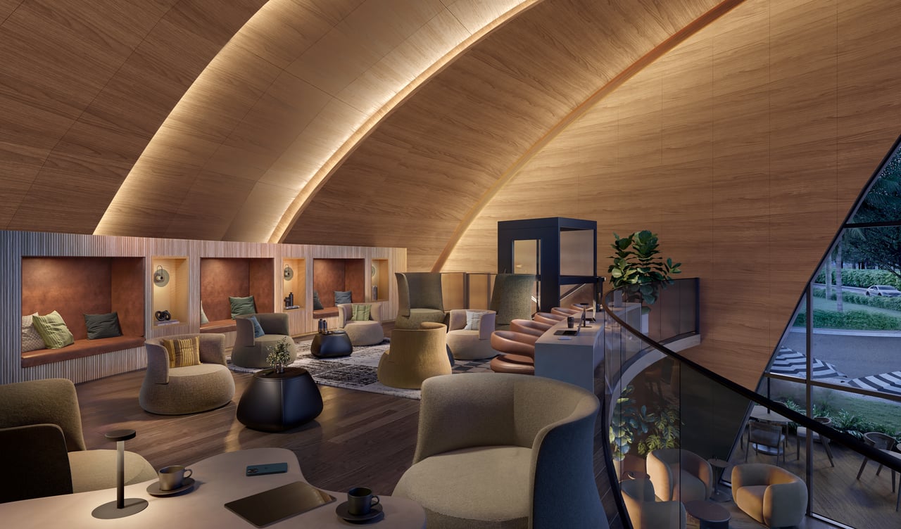 NEXO Residences lounge with curved seating, built-in banquette and a sweeping timber-paneled ceiling.