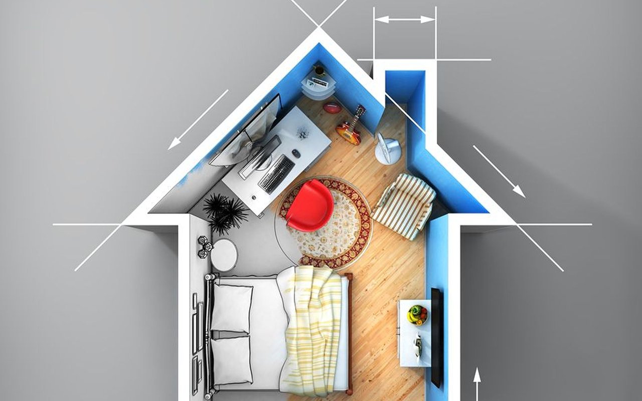 Illustrated compact apartment floor plan with a bed, desk, and seating area.