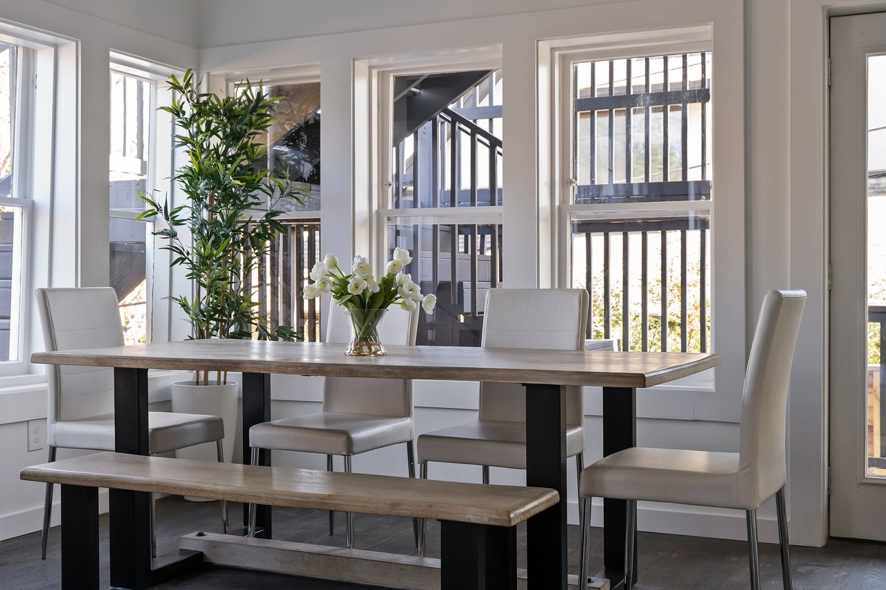 Dining area in the open-concept layout, interiors by local artisan Don Rojo, at 701 Highland Ave Unit #1, Clarksville, Austin, Texas.