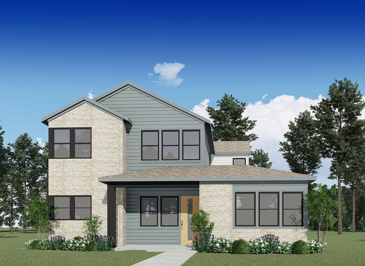 Modern two-story house with gray siding, light brick, and landscaped flower beds.