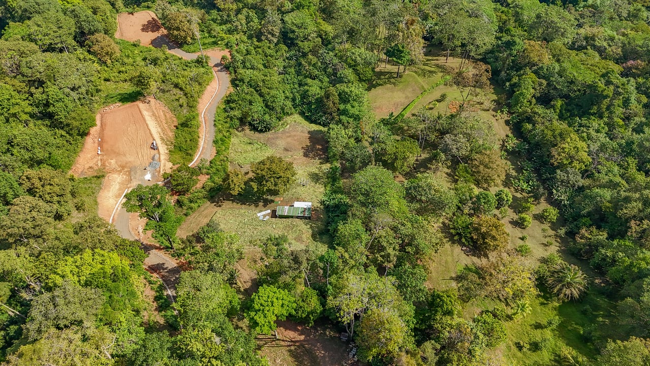 Jungle, Mountain & Valley View Lot with Two Large Plantels, Bordering a Crystal Mountain River with Swimholes & a Waterfall