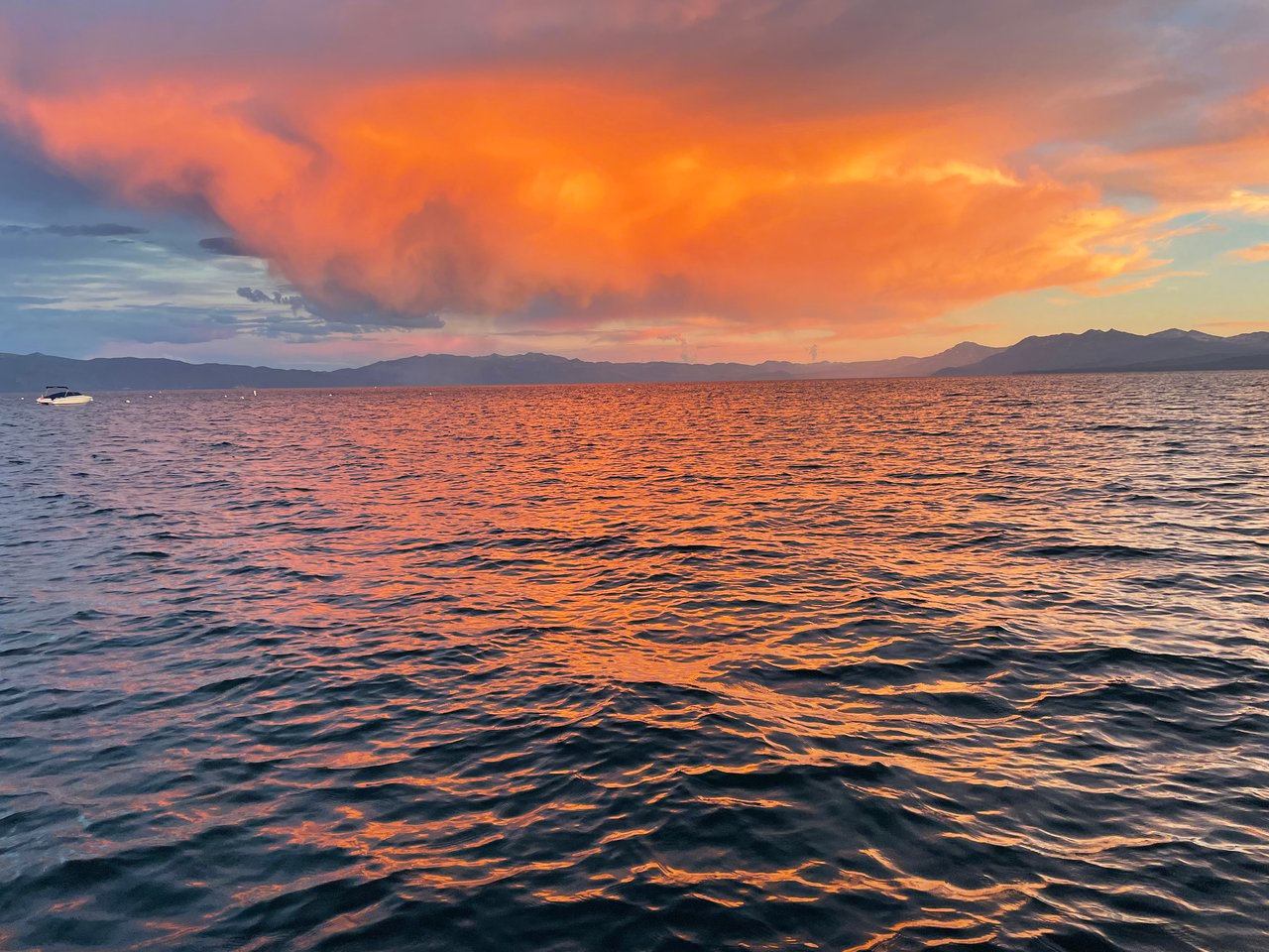Lake Tahoe shoreline near Tahoe City with homes, pine trees, and beach access