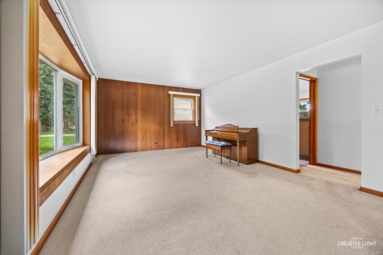 Living room with bow window in the ranch home at 304 Crestwood Drive, Roselle, IL