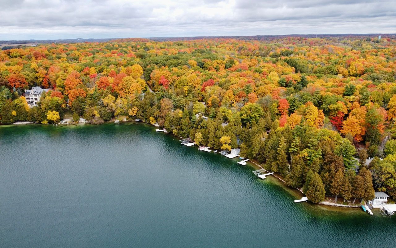 Aerial view of Juneau County, Wisconsin, featuring rolling farmland, forests, and winding rivers, showcasing the area's natural beauty and rural charm