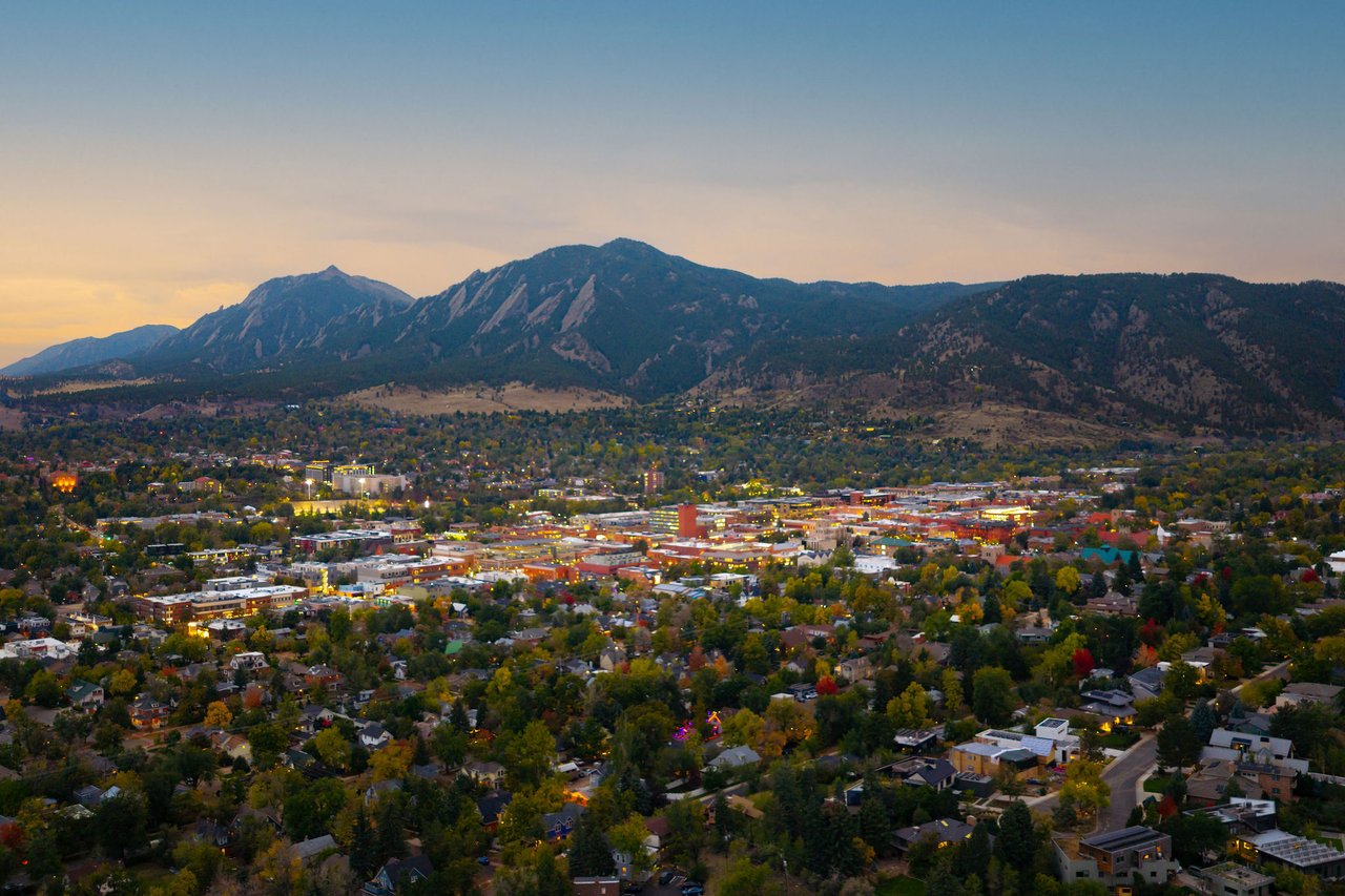 Aerial twilight view of downtown Boulder and the Flatirons, just blocks from 2003 Balsam Drive