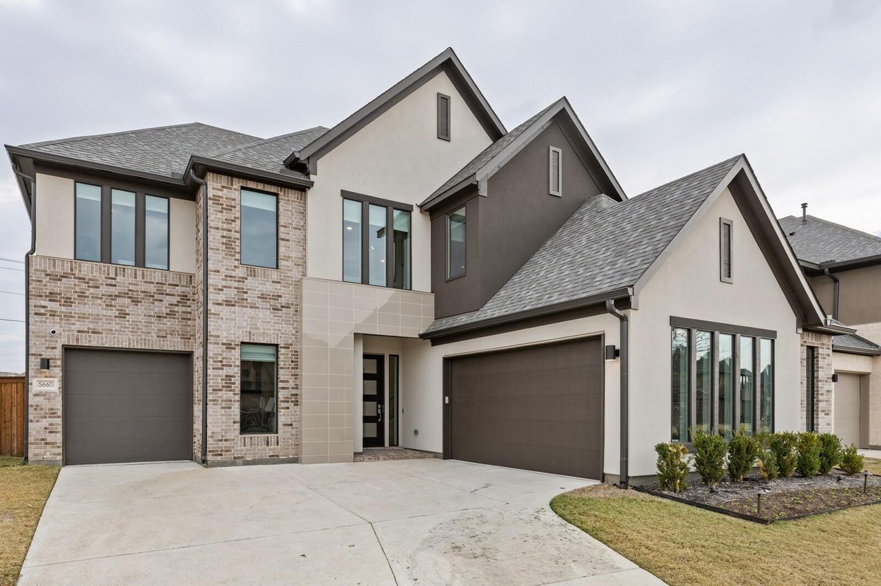 Modern luxury home exterior with brick and stucco facade in Phillips Creek Ranch, Frisco TX — a premier master-planned community in North DFW.